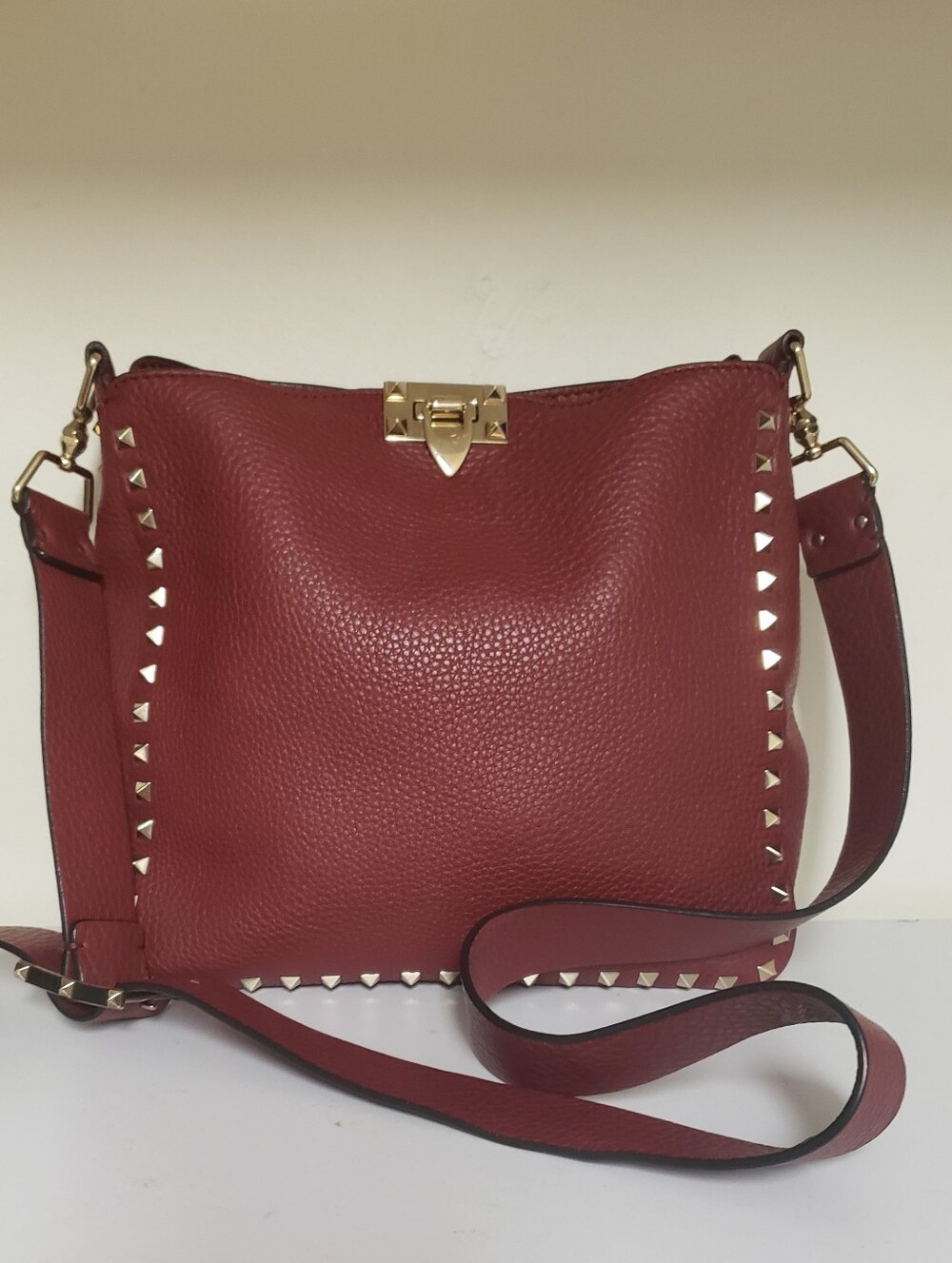 Valentini Garavavi Rosckstud flip lock Messenger hobo bag.